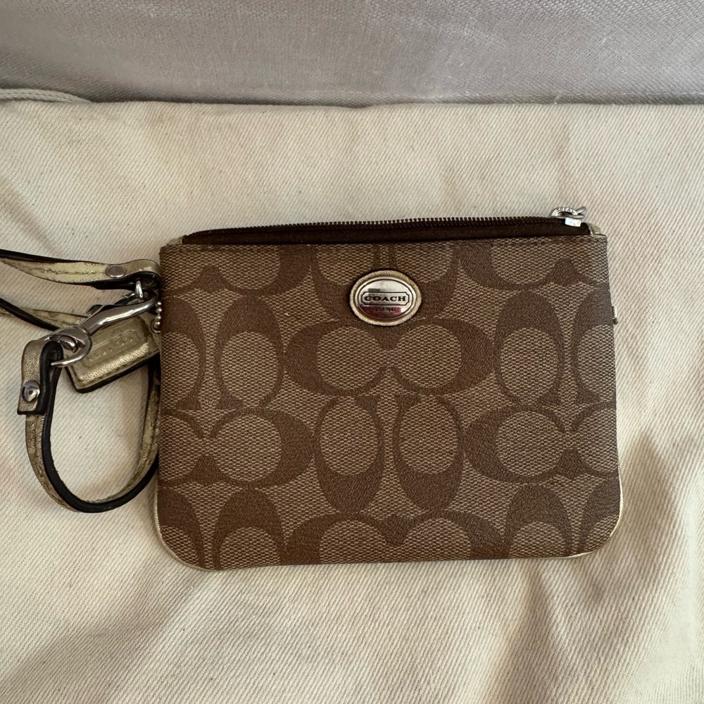 Coach Brown Signature Wristlet. Read full description.